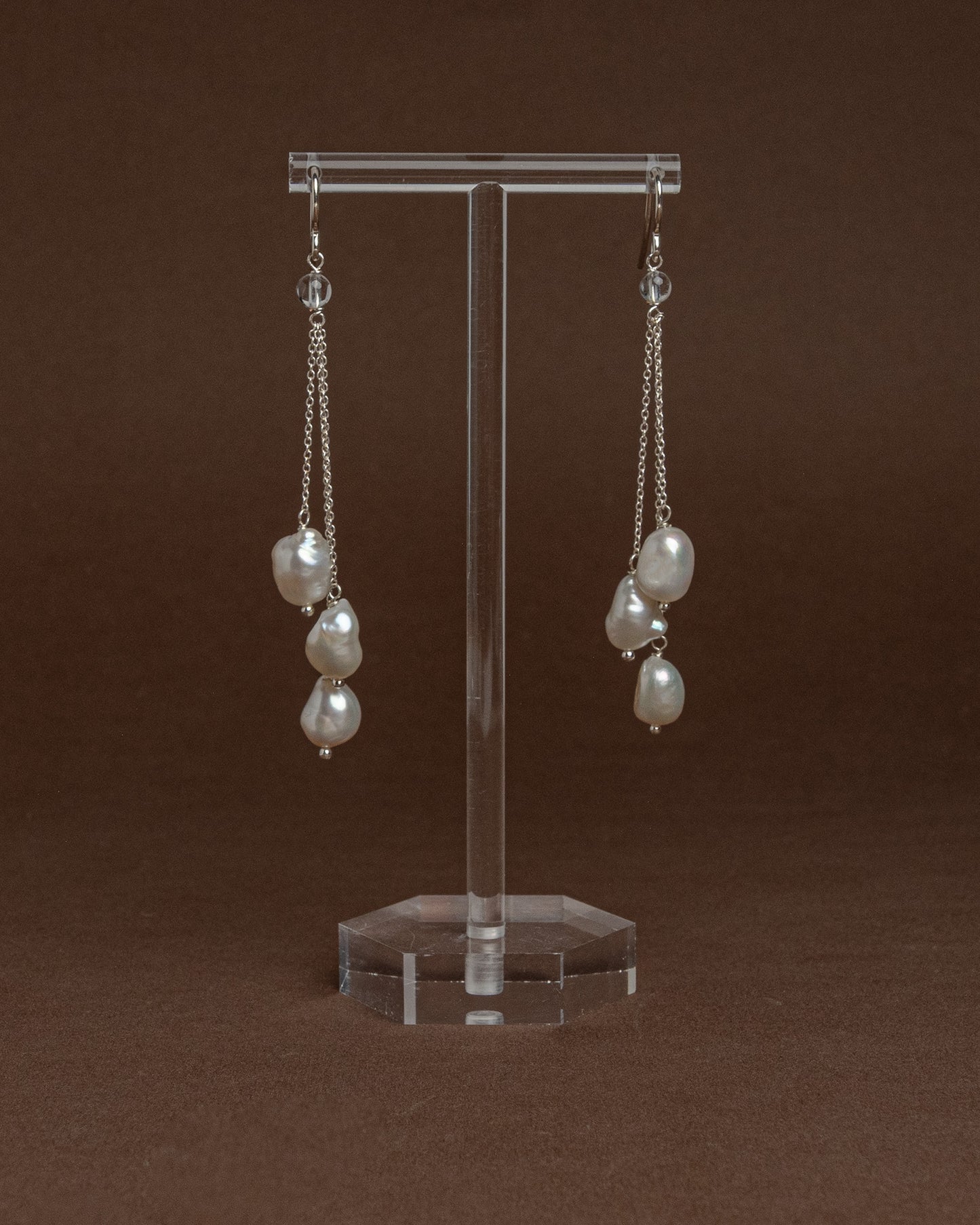 Cascade earrings with sterling silver chains and large baroque pearls. Unique handmade jewelry perfect for bridal wear or minimalist luxury looks.