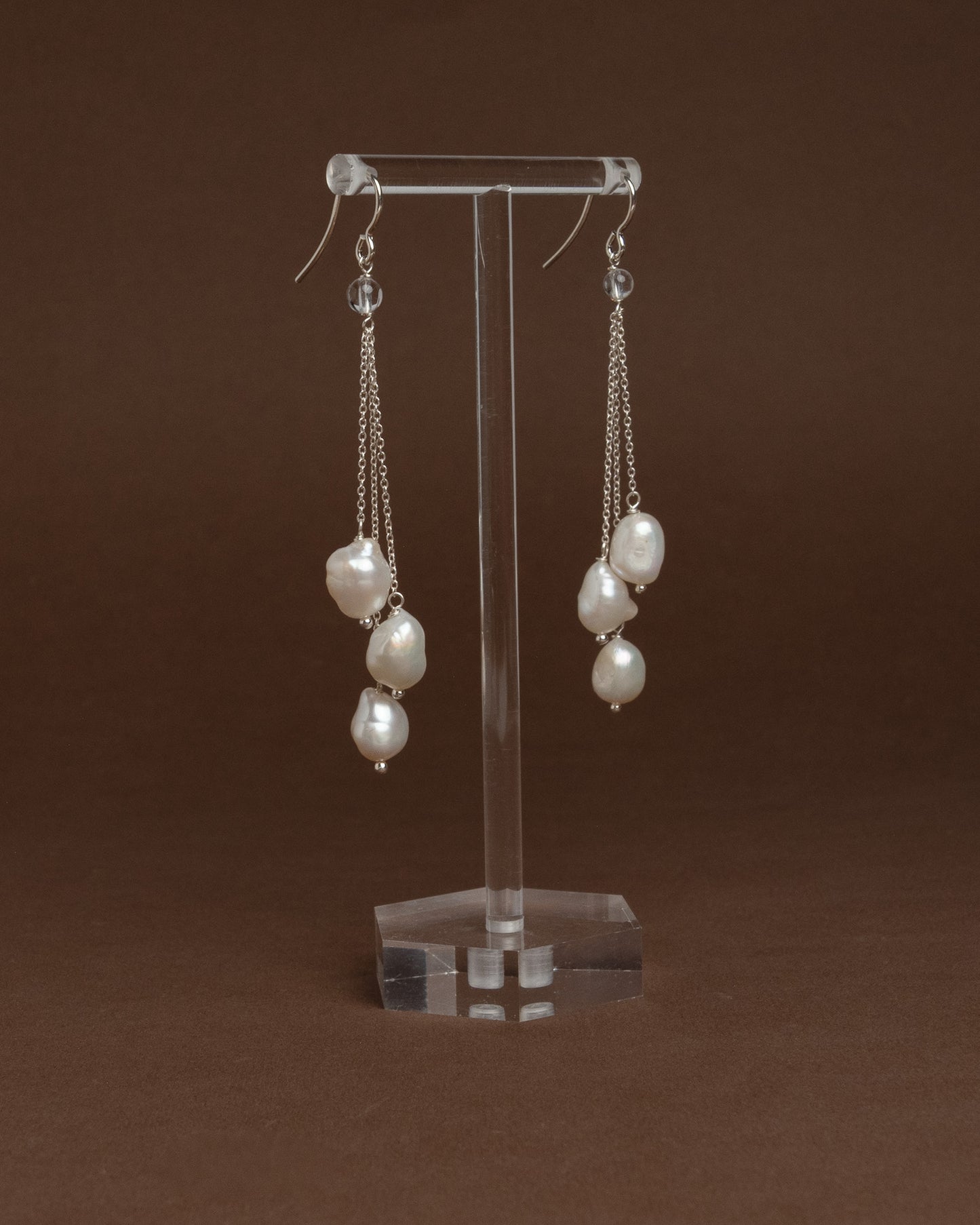 Cascade earrings with sterling silver chains and large baroque pearls. Unique handmade jewelry perfect for bridal wear or minimalist luxury looks.
