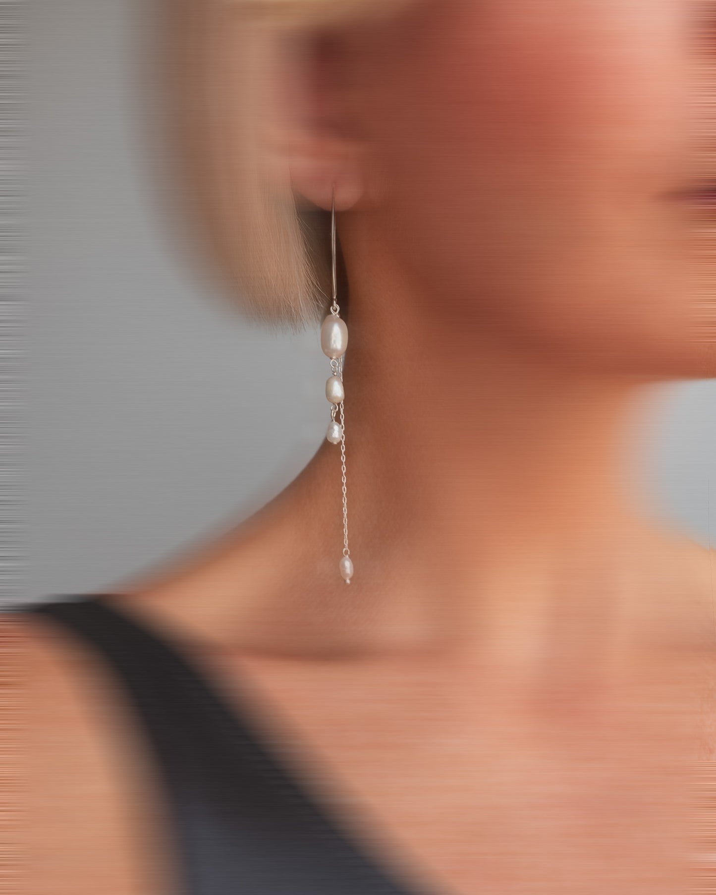 Elegant long earrings with baroque freshwater pearls and silver chains. Handmade and unique, ideal for brides and special occasions.