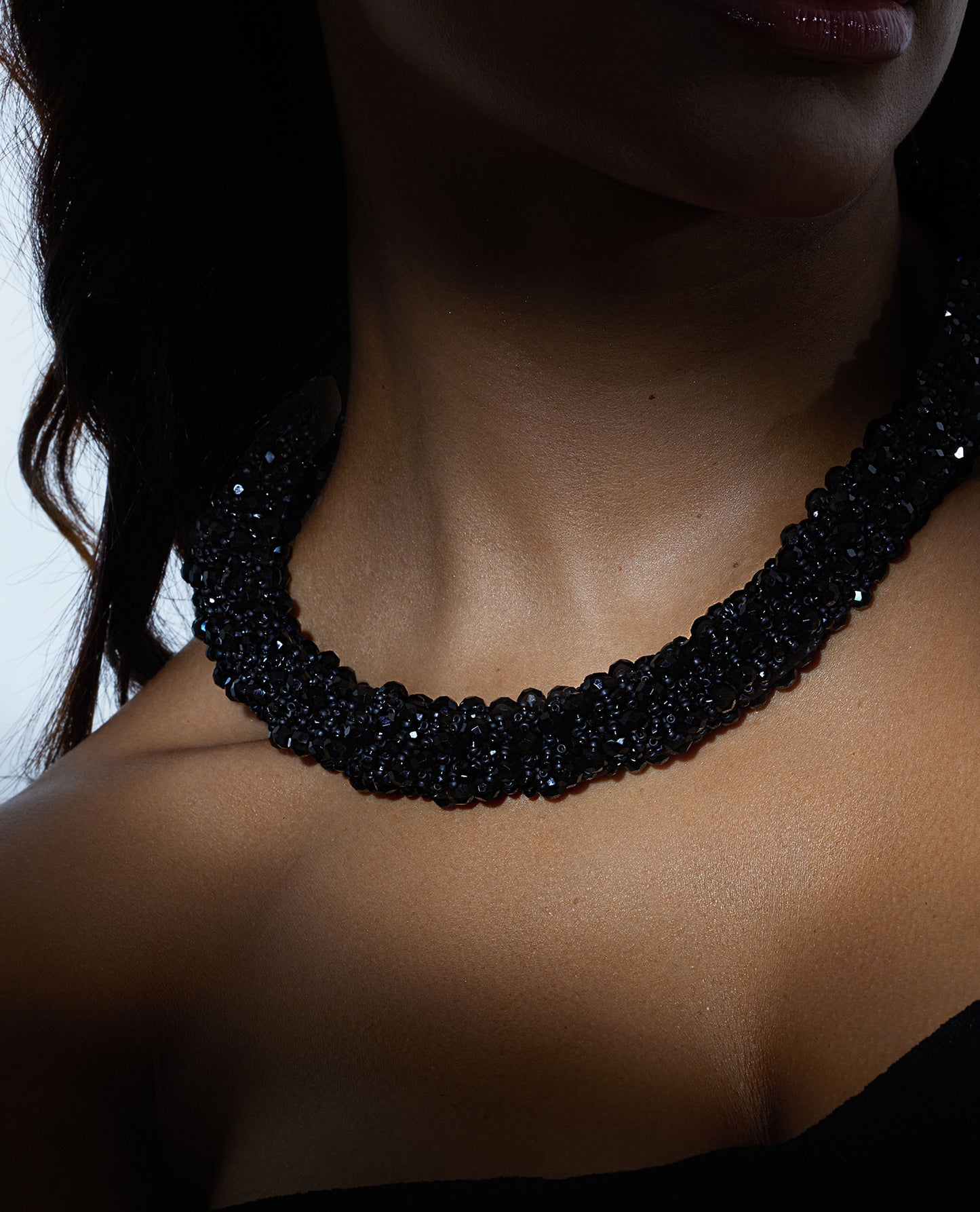 Necklace of black crystals with Japanese seed beads and a stainless steel T-clasp, 52 cm long, designed for versatile styling.