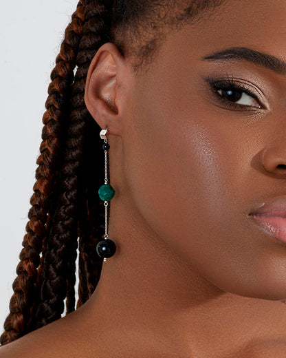 Long earrings featuring black and green agate beads arranged on a silver chain with cubic silver studs, 7 cm in length.