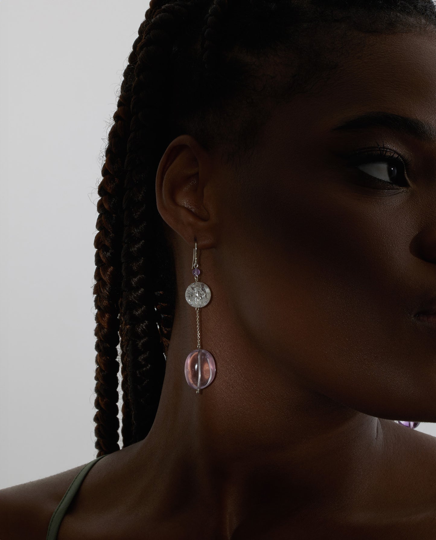 Elegant chain earrings featuring shimmering Crackle Quartz and a deep purple oval Amethyst stone, suspended from silver chains with hooks.