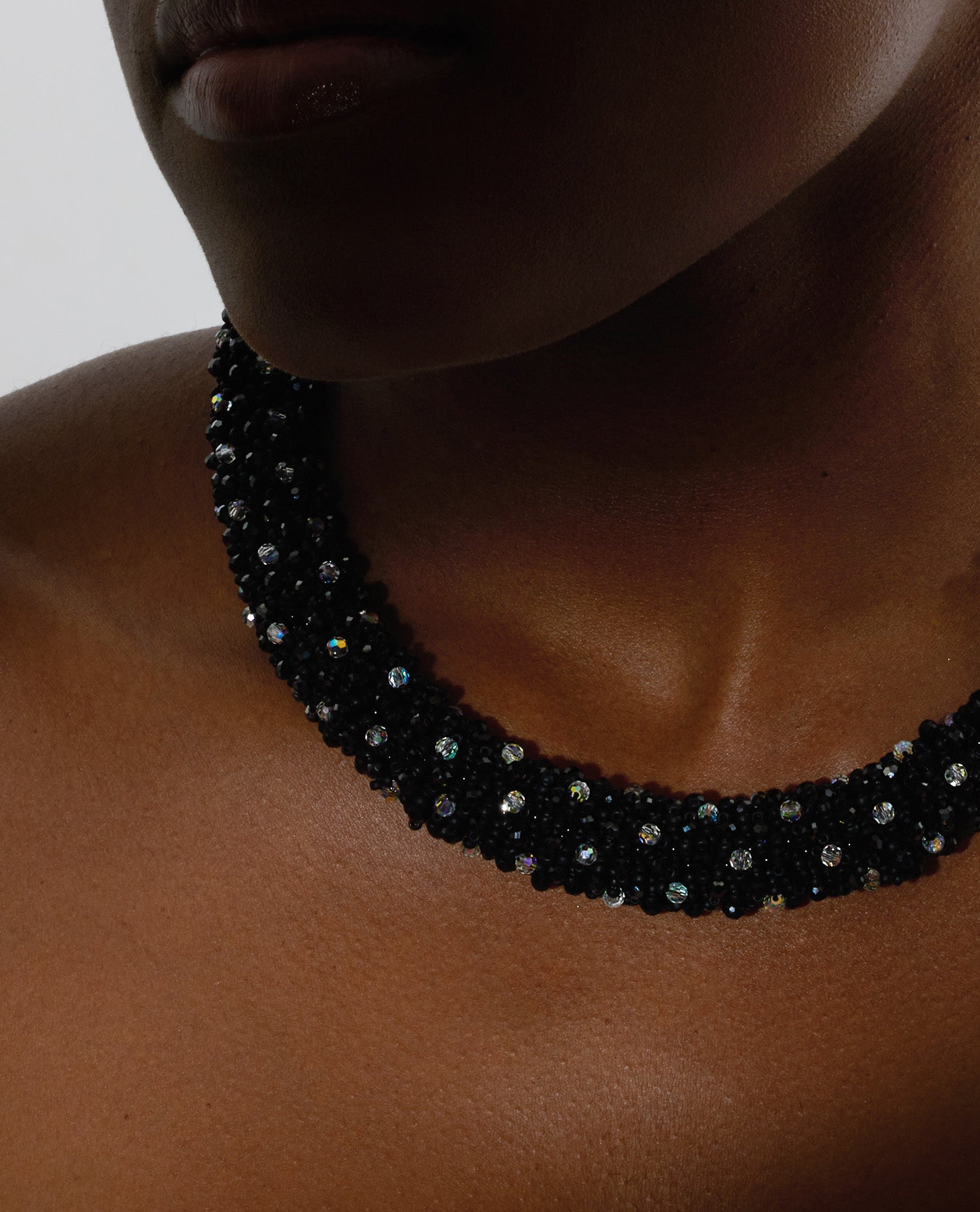 Spinel and crystals necklace featuring deep black spinel stones and shimmering crystals with a stainless steel T-bar clasp, 45 cm in length, offering bold elegance.