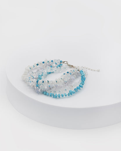 Mixed gemstones bracelet featuring topaz, apatite, turkenite, chalcedony, and quartz stones with silver accents in a boho-chic design.