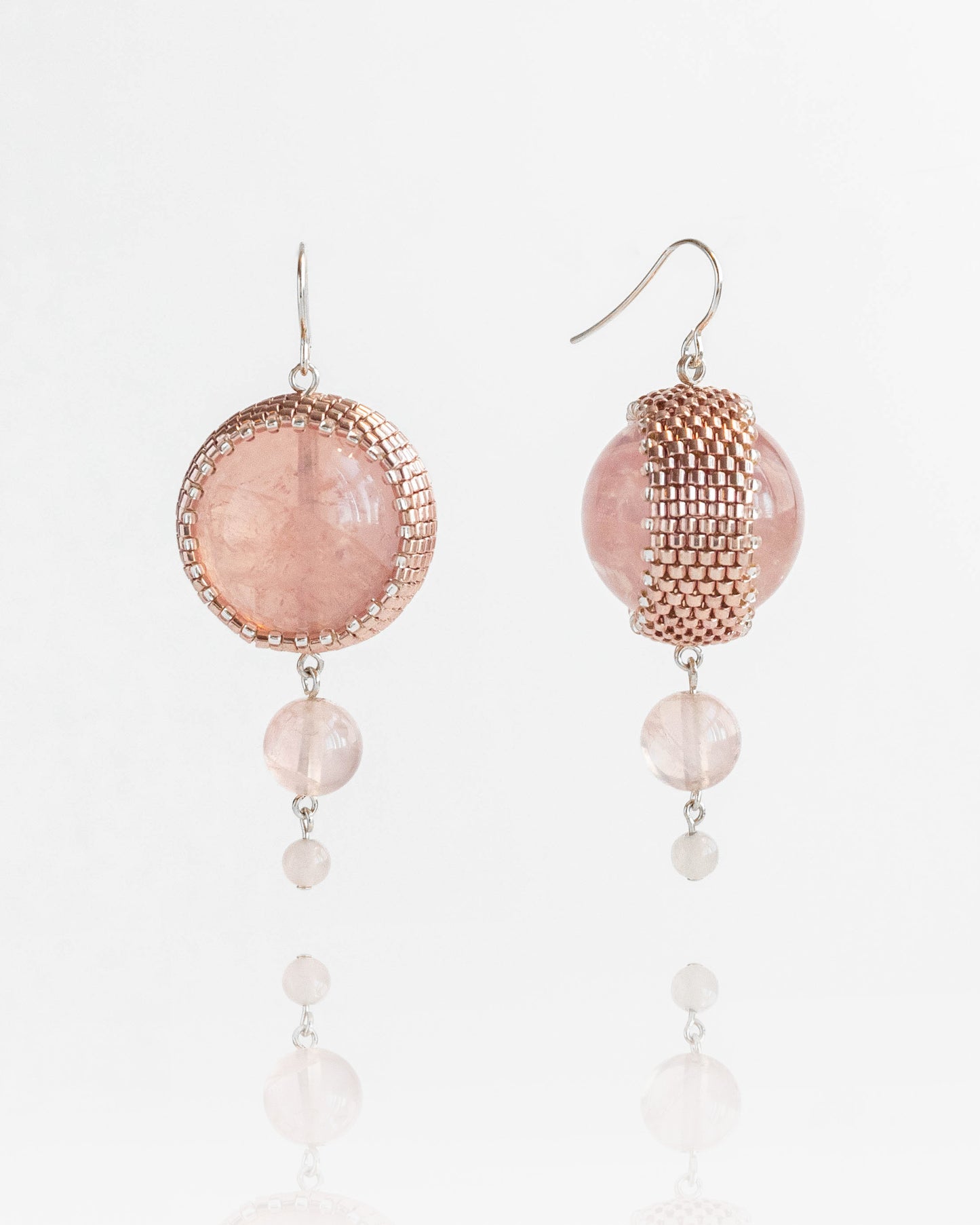 Double rose quartz earrings featuring two radiant pink stones with silver hooks, 6 cm in length, offering natural elegance.