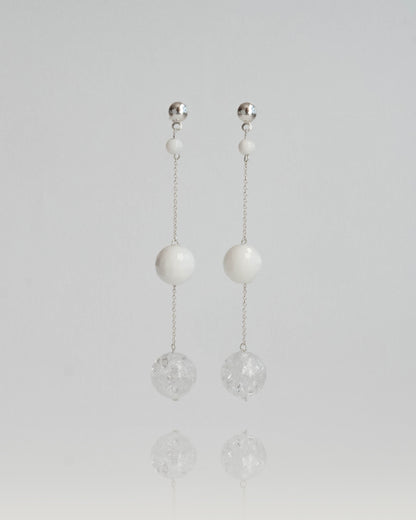 Delicate chain earrings featuring luminous Clear Quartz and soft White Coral, suspended from silver chains with hooks, 8 cm in length.