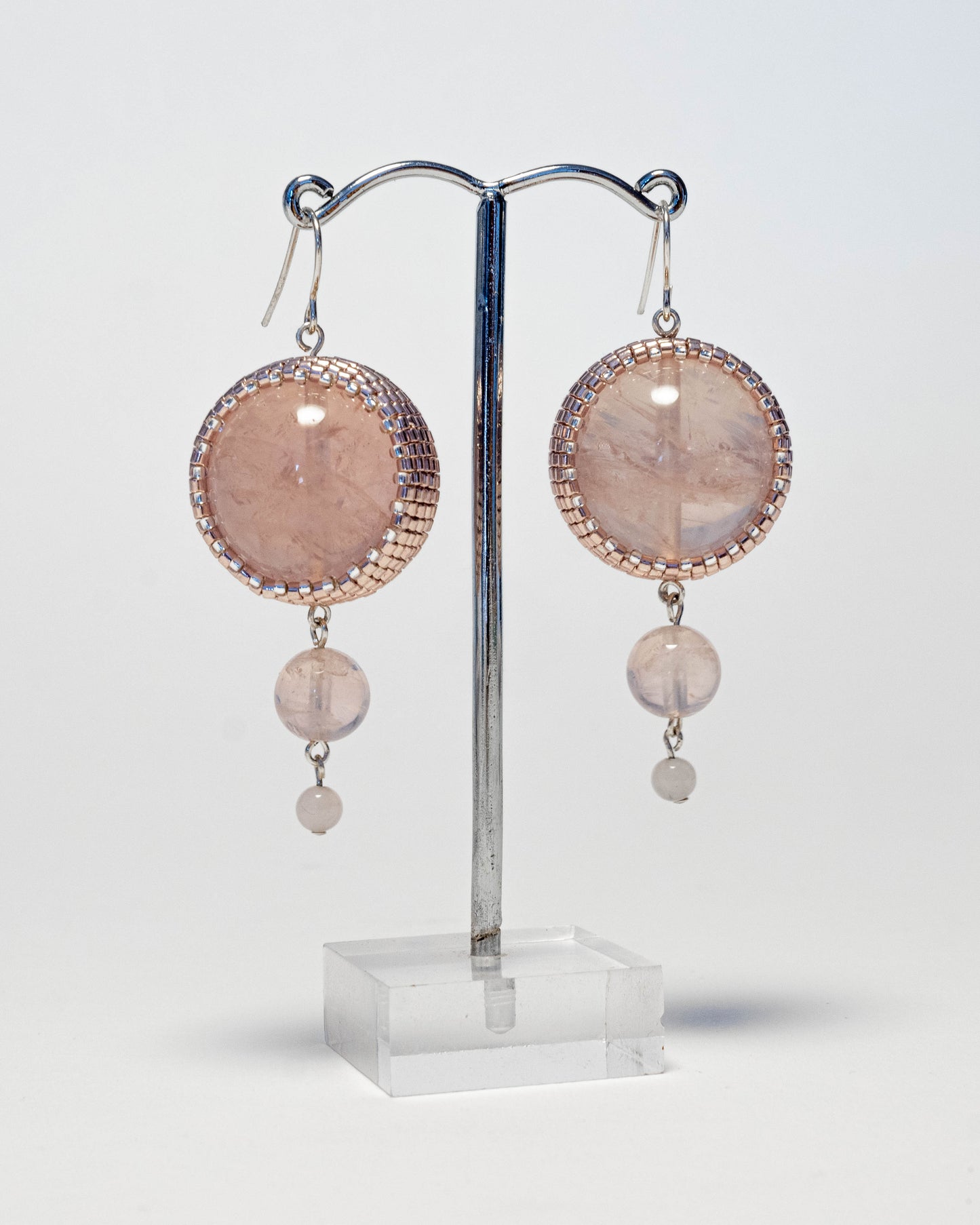 Double rose quartz earrings featuring two radiant pink stones with silver hooks, 6 cm in length, offering natural elegance.