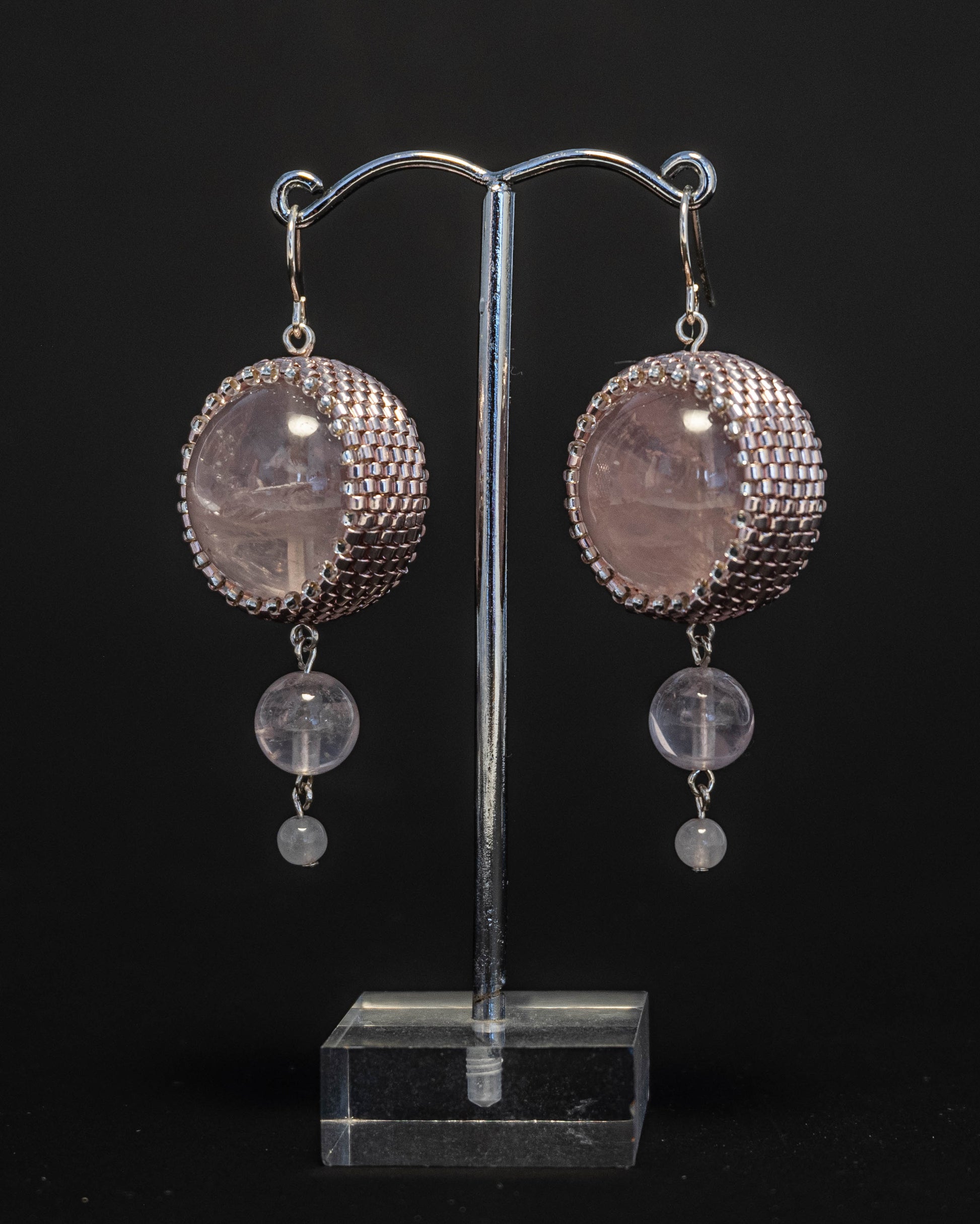 Double rose quartz earrings featuring two radiant pink stones with silver hooks, 6 cm in length, offering natural elegance.