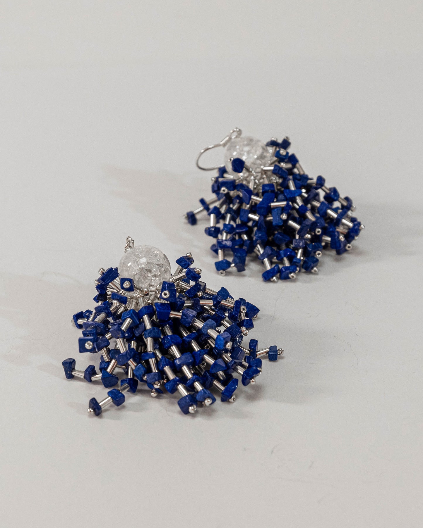 Lapis lazuli sparkling fringe earrings featuring vibrant blue gemstones with silver hooks, 6 cm in length, offering timeless elegance.