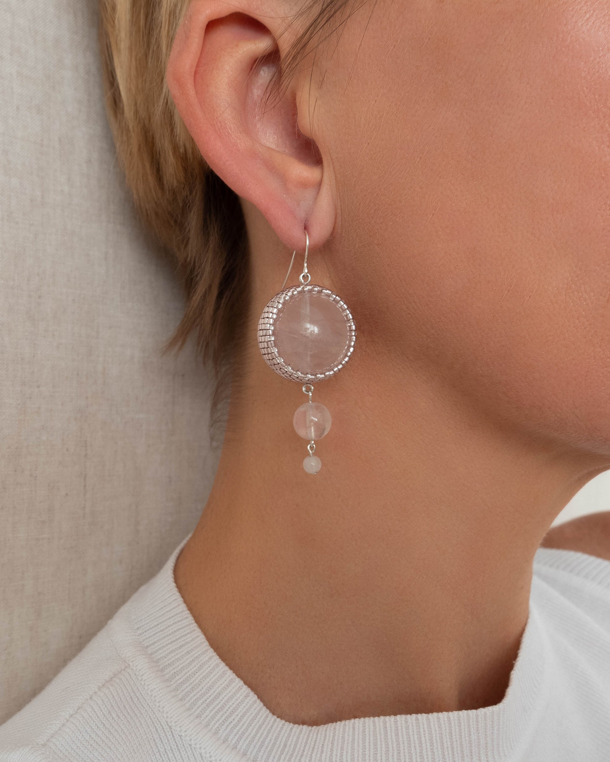 Double rose quartz earrings featuring two radiant pink stones with silver hooks, 6 cm in length, offering natural elegance.