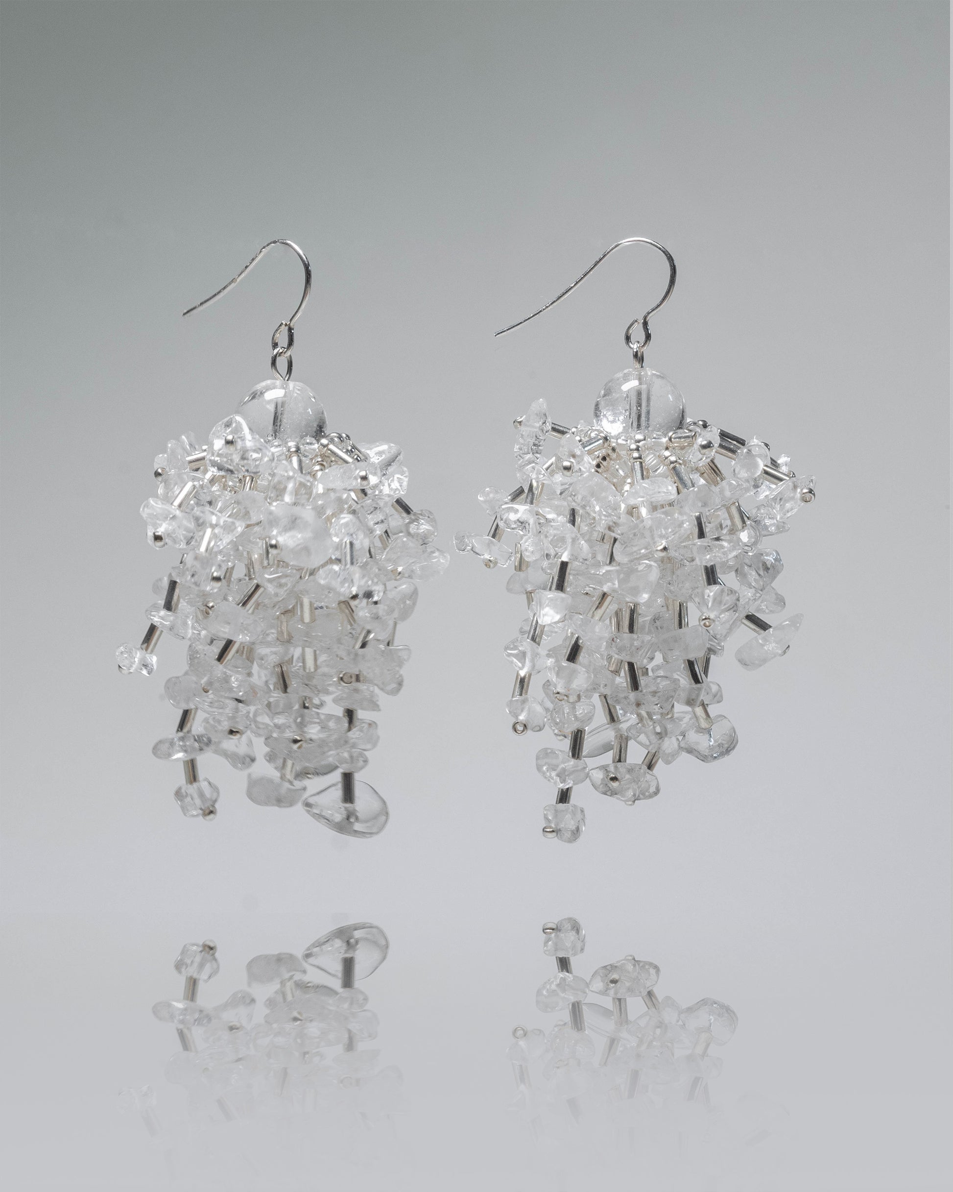 Dangle earrings featuring sparkling clear quartz stones in a fringe design with silver hooks, 6 cm in length, exuding elegance and sophistication.