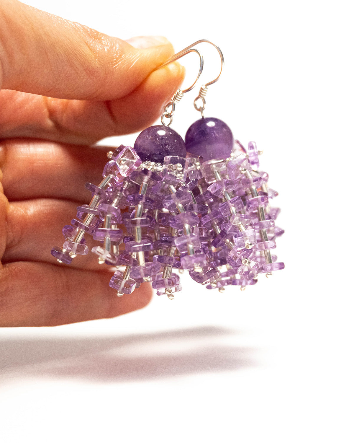 Fringe amethyst earrings featuring vibrant purple gemstones and silver hooks, 6 cm in length, offering natural elegance and fluid design.