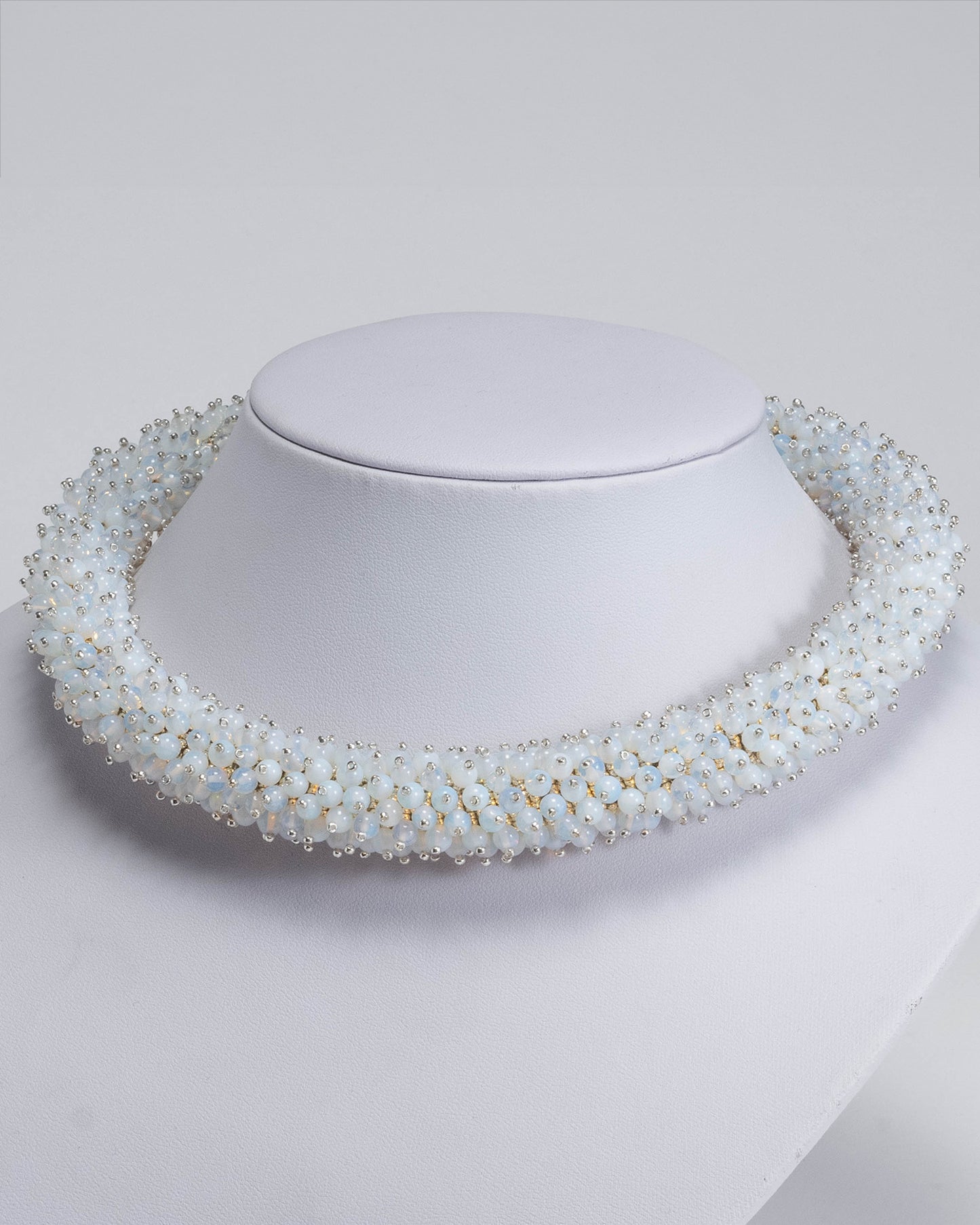 Radiant opalite necklace featuring opalescent beads in a bold rope design with a silver T-bar clasp, 45 cm in length, perfect for haute couture styling.