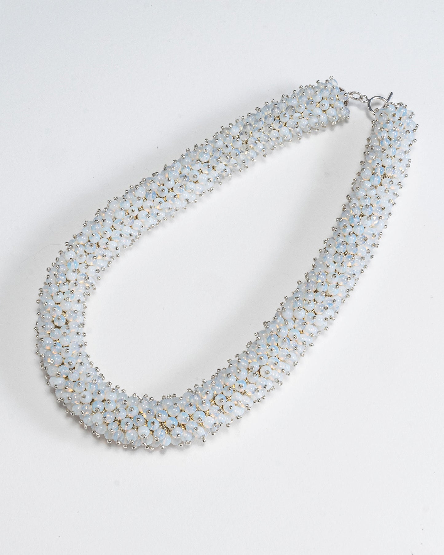 Radiant opalite necklace featuring opalescent beads in a bold rope design with a silver T-bar clasp, 45 cm in length, perfect for haute couture styling.