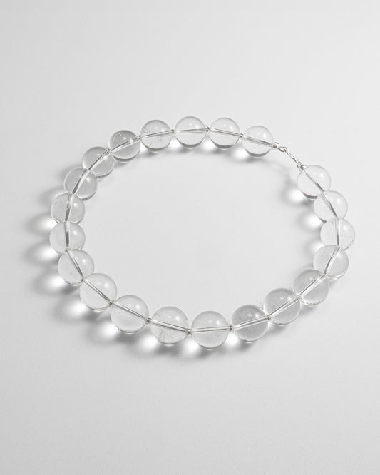 Quartz big beads short necklace featuring transparent quartz gemstones with a stainless steel clasp, 45 cm in length, offering a timeless and elegant design.