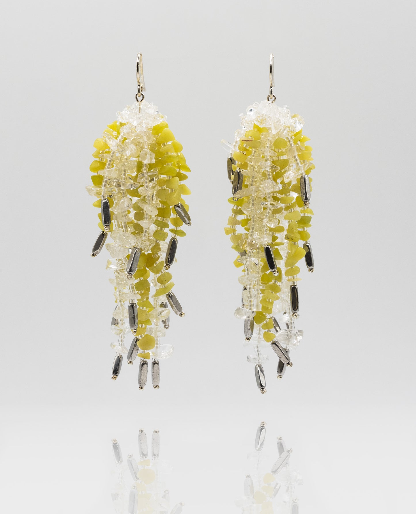 Mixed earrings featuring transparent clear quartz, bright yellow sulfur stones, and oval hematite beads with silver hooks, 8 cm in length.