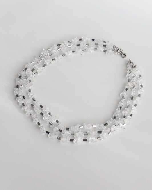 Short necklace with clear quartz chips and geometric hematite beads, featuring silver findings and a lobster clasp, 40 cm in length.