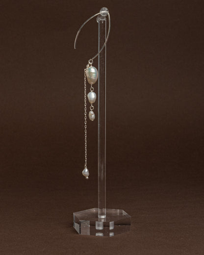 Elegant long earrings with baroque freshwater pearls and silver chains. Handmade and unique, ideal for brides and special occasions.
