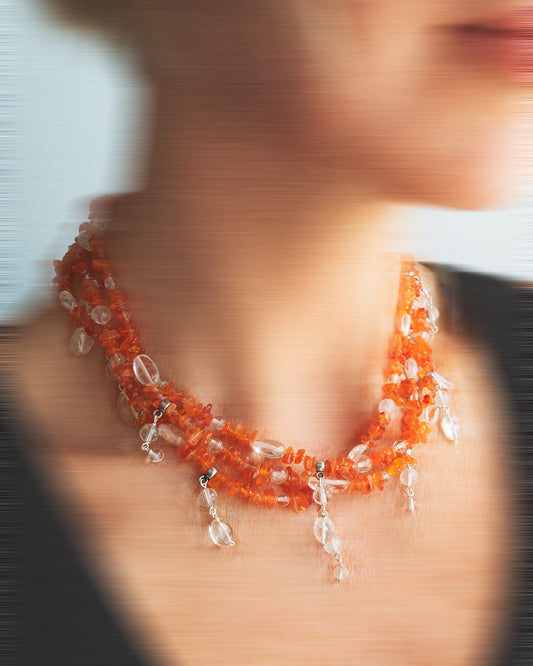 Handmade layered carnelian and quartz necklace with quartz charms. Unique natural stone design with elegance and energy.
