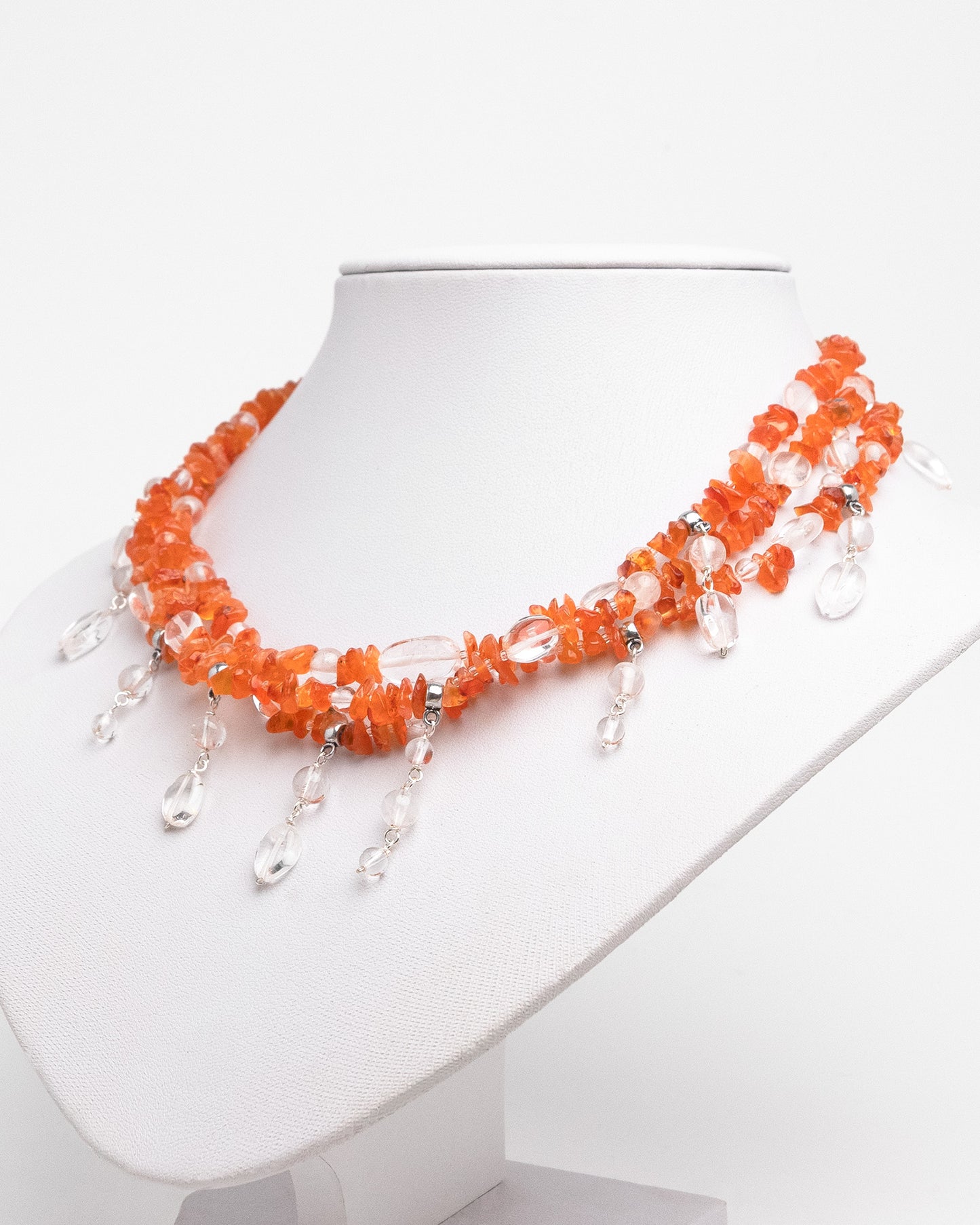 Handmade layered carnelian and quartz necklace with quartz charms. Unique natural stone design with elegance and energy.