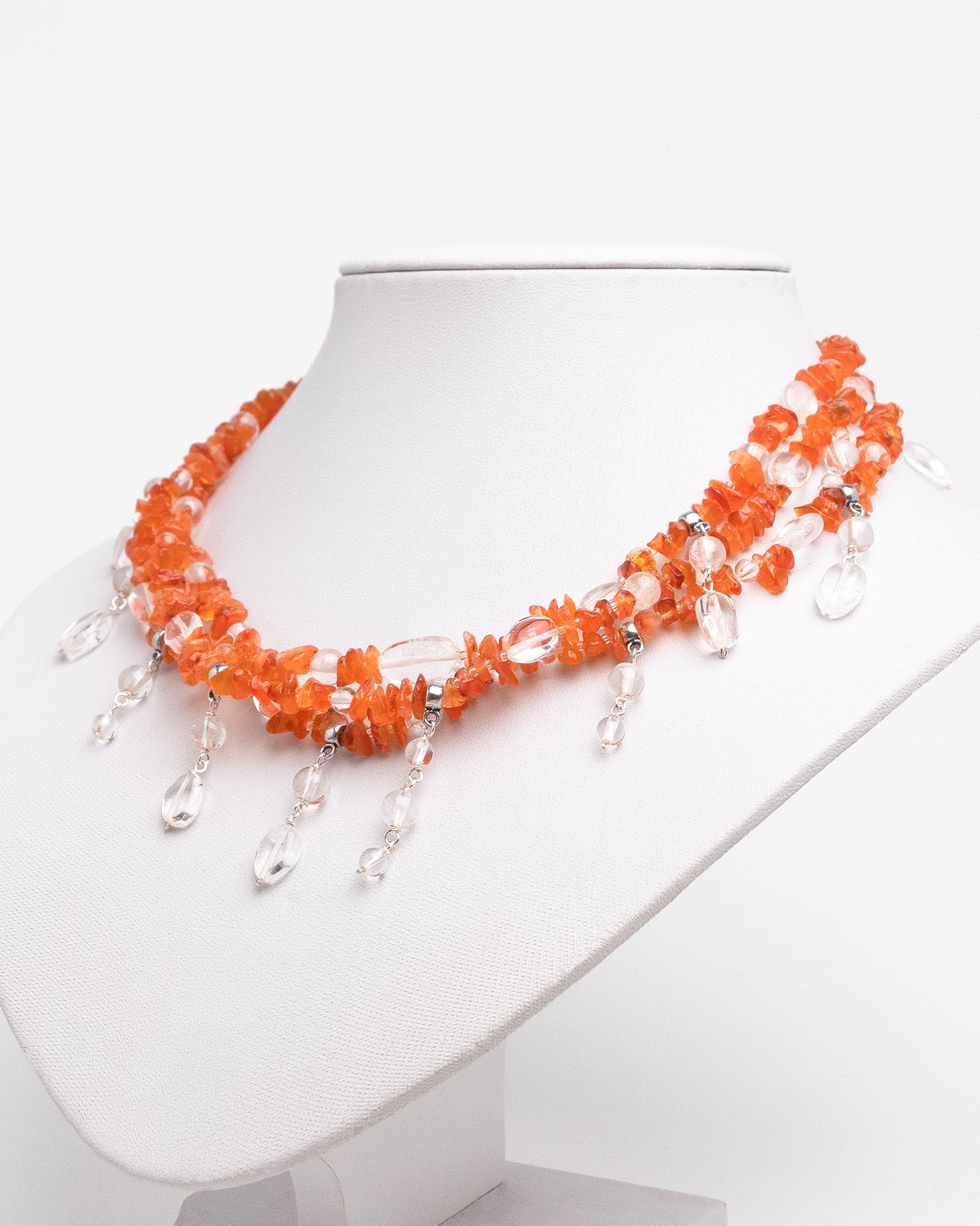 Handmade layered carnelian and quartz necklace with quartz charms. Unique natural stone design with elegance and energy.
