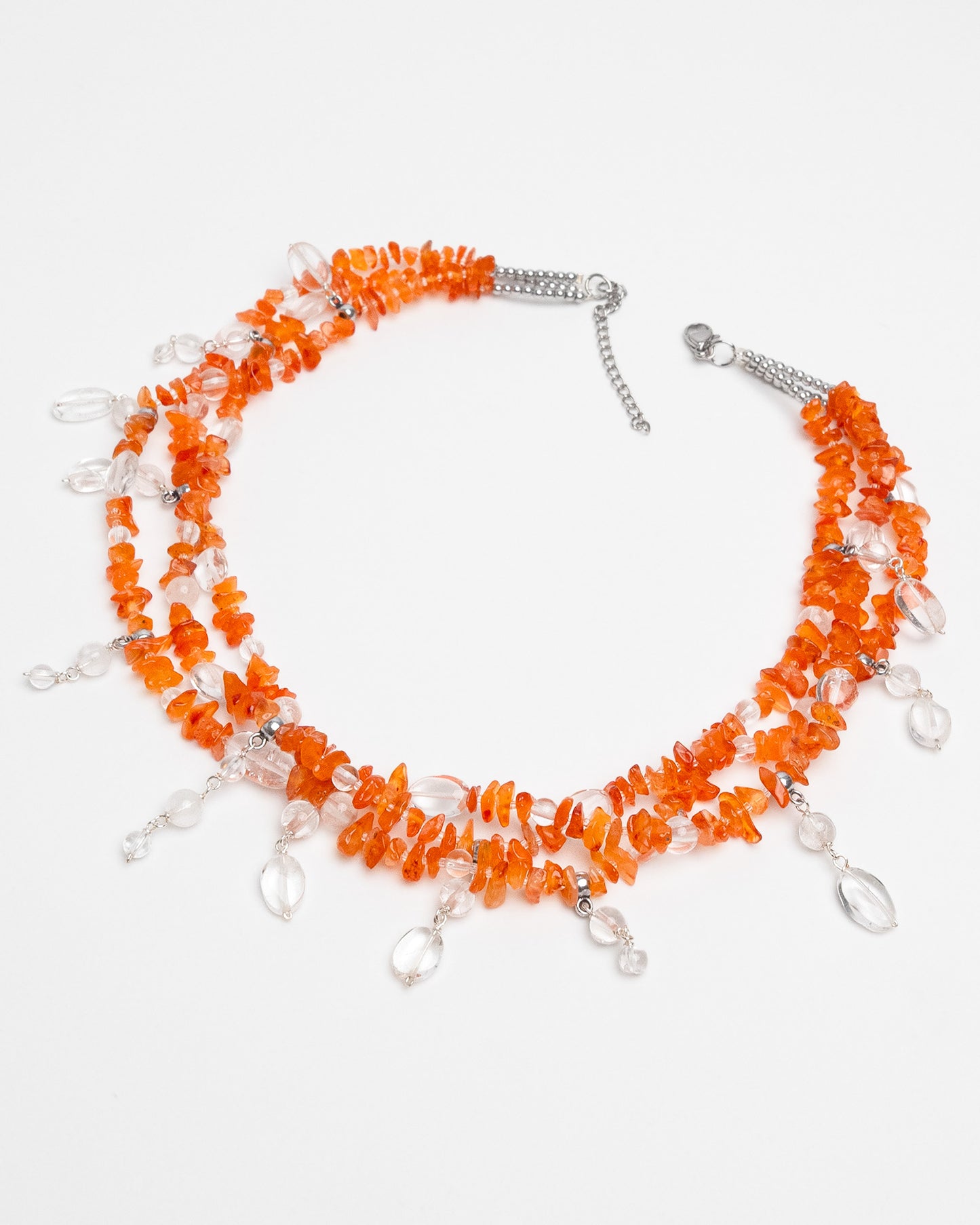 Handmade layered carnelian and quartz necklace with quartz charms. Unique natural stone design with elegance and energy.
