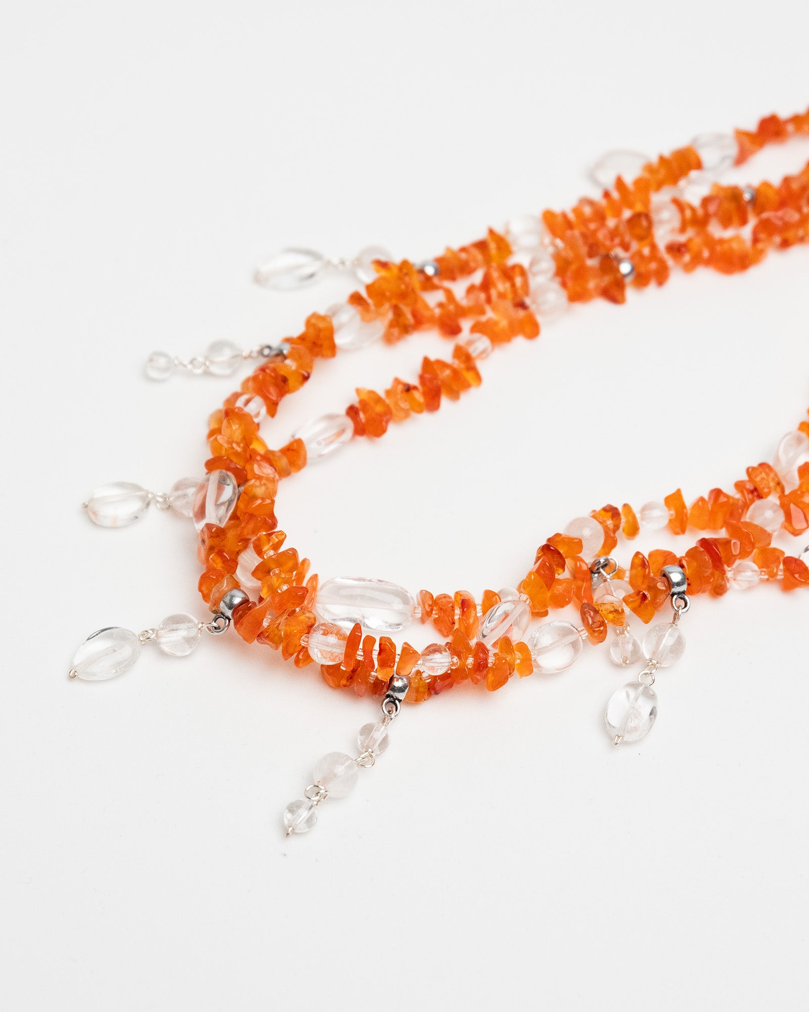 Handmade layered carnelian and quartz necklace with quartz charms. Unique natural stone design with elegance and energy.