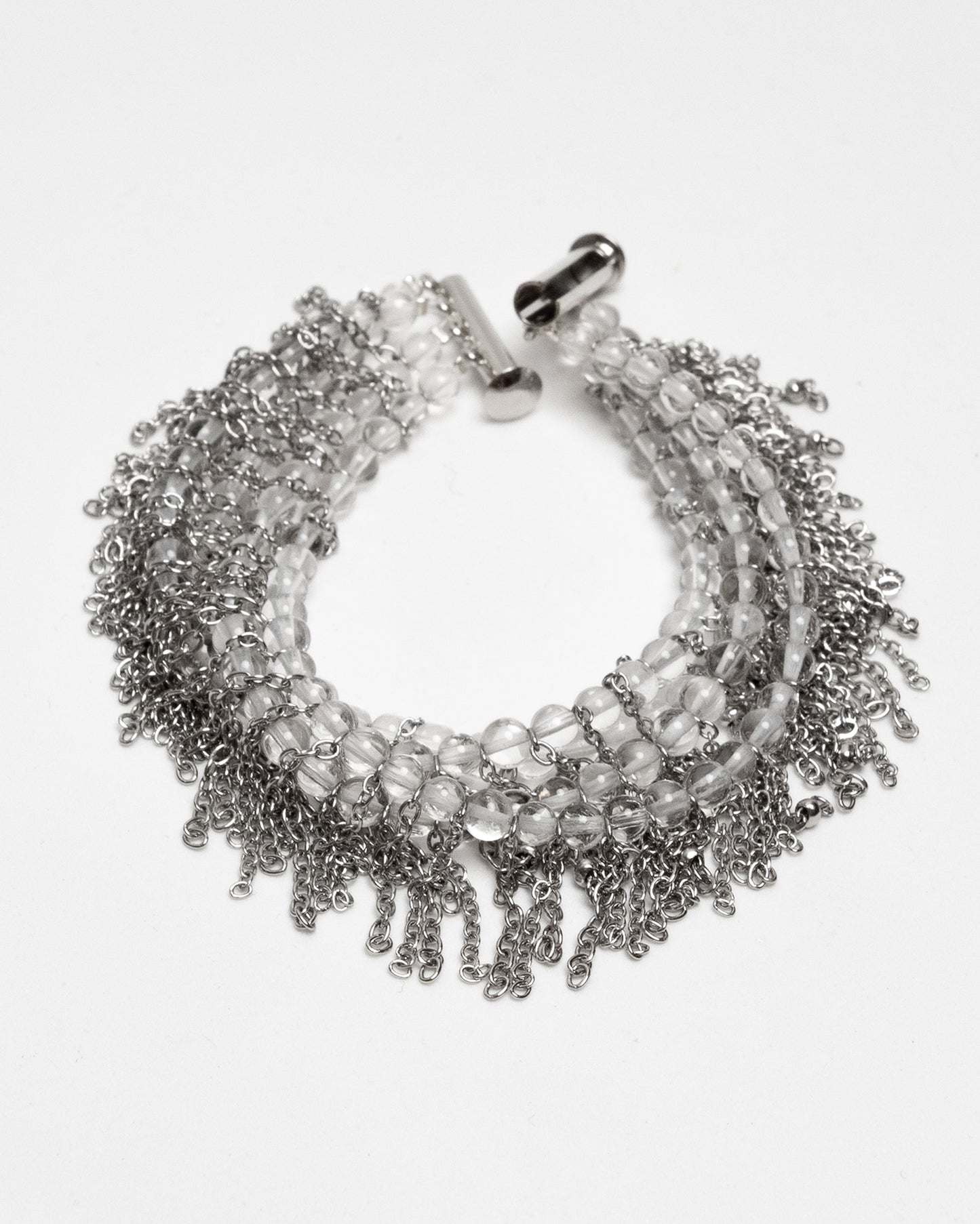 Pulsera de cuarzo y acero inoxidable con cierre magnético y cadenas tipo flecos