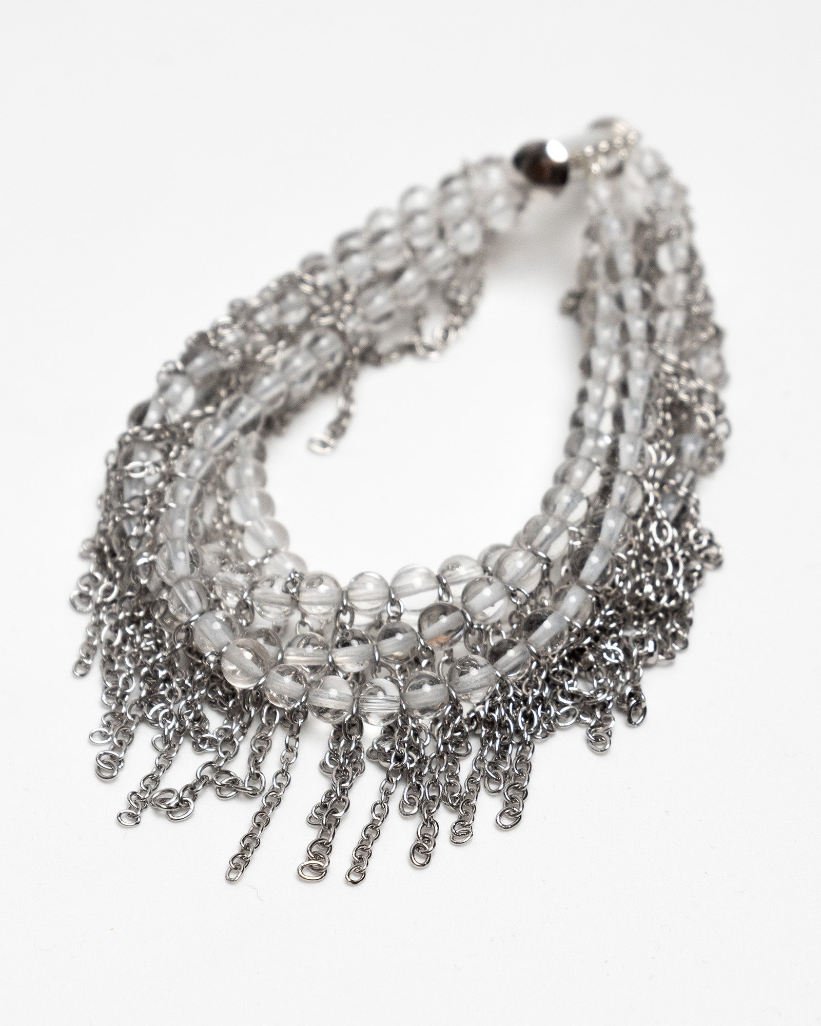 Pulsera de cuarzo y acero inoxidable con cierre magnético y cadenas tipo flecos