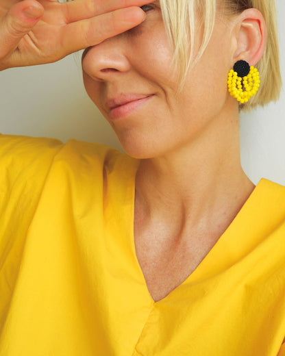 Summer style yellow earrings featuring sunny crystals and Japanese seed beads with silver studs, 5 cm in length, perfect for vibrant seasonal looks.