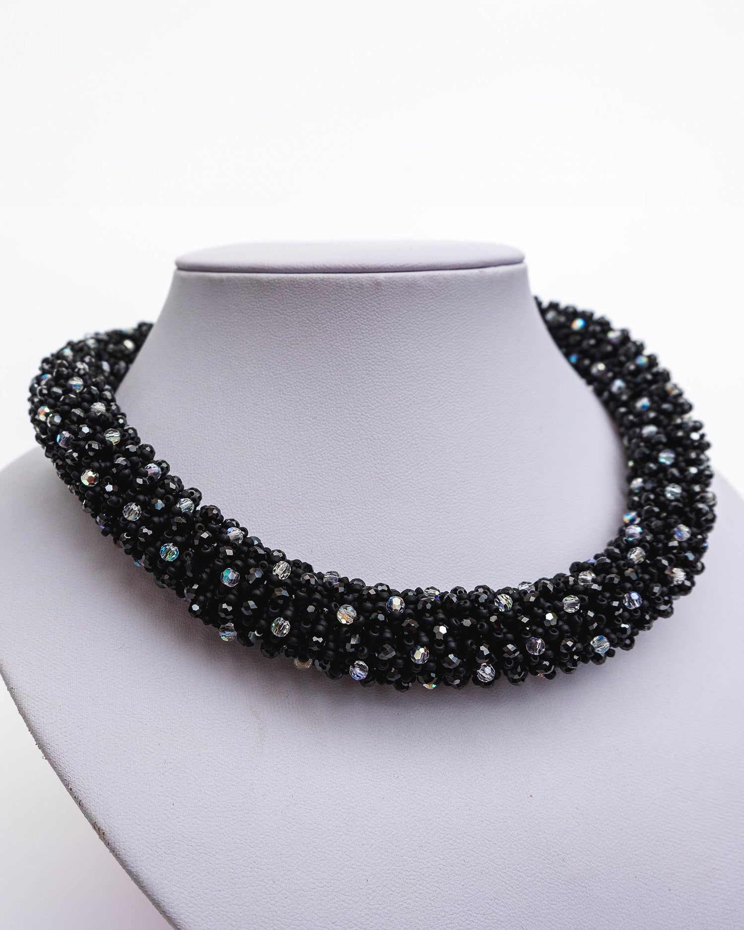 Spinel and crystals necklace featuring deep black spinel stones and shimmering crystals with a stainless steel T-bar clasp, 45 cm in length, offering bold elegance.