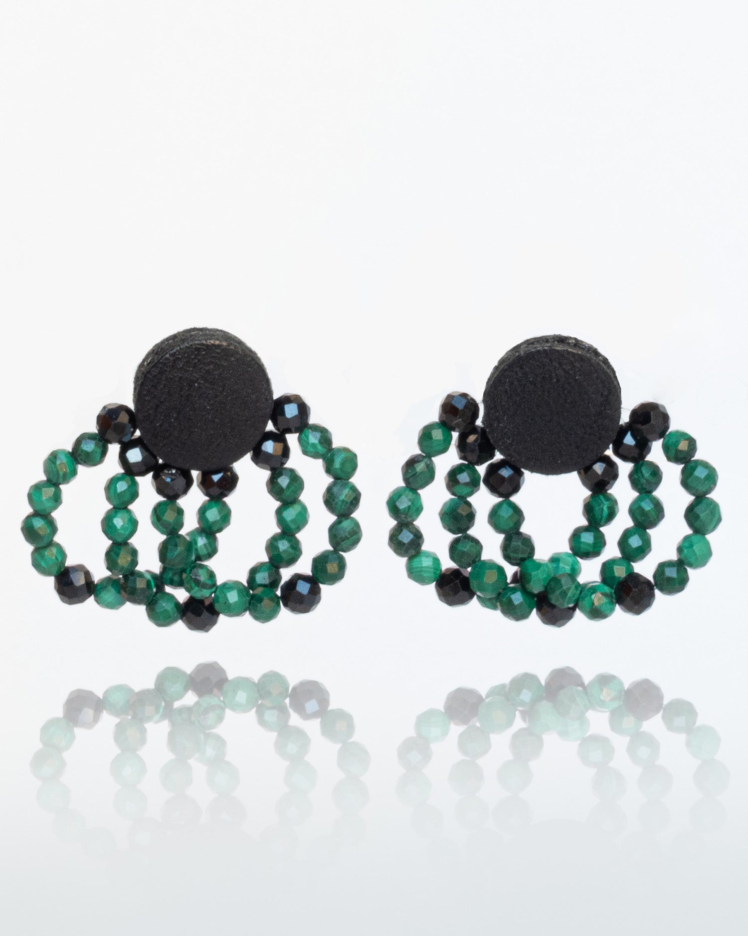 Malachite bead and leather earrings with silver studs, 2 cm in length, offering a bold and modern design.