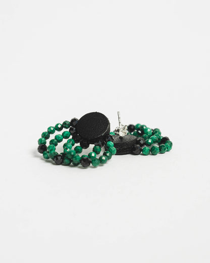 Malachite bead and leather earrings with silver studs, 2 cm in length, offering a bold and modern design.